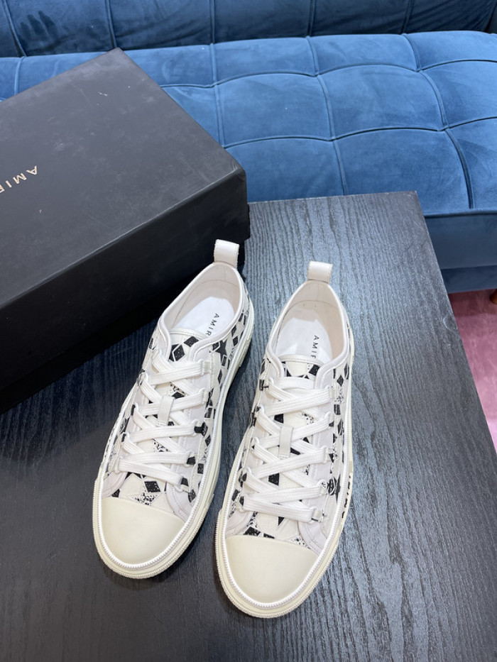 amiri* appliquéd leather and canvas sneakers